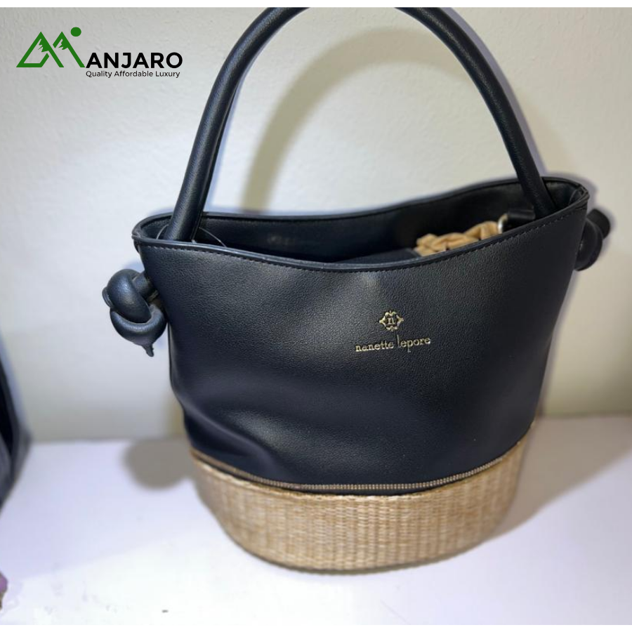 Nanette Lepore Black Faux Leather Bucket Bag – Unique Crossbody/Shoulder Purse with Woven Straw Base & Knot Handles